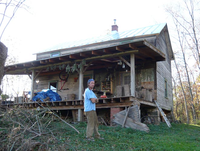 Mike Dwyer in front of the house he is restoring