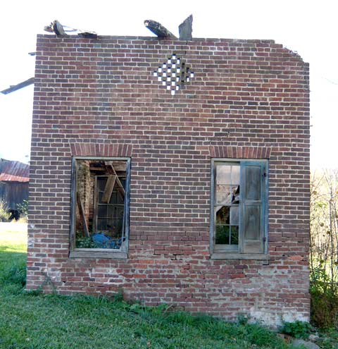 brick building behind the main house